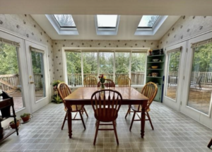 Dated dining Room with tons of natural light