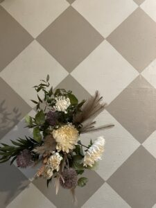 Cream and warm brown coloured flooring painted in a tile pattern